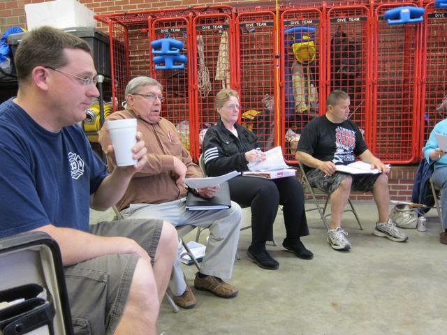 The Board of Directors meets in the Utility 13 engine bay on April 15, 2013.