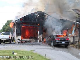 Crews found a working garage fire with extension into the house and an auto fire in the driveway.